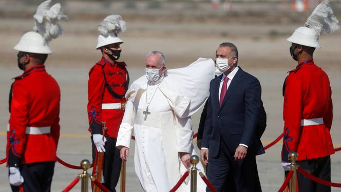 Pope Francis is received by Iraqi Prime Minister Mustafa Al Kadhimi upon disembarking from his plane at Baghdad International Airport to start his historic tour in Baghdad, Iraq, on March 5, 2021.