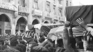 Flag-draped coffins of slain Palestinians killed in Israeli raid are taken through the streets of Beirut, Lebanon in 1973, during the funeral procession.