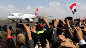 Relatives react as International Committee of the Red Cross (ICRC)-chartered plane lands carrying freed prisoners, at Sanaa Airport, amid a prisoner swap between two sides in the Yemen conflict, in Sanaa, Yemen on Saturday.