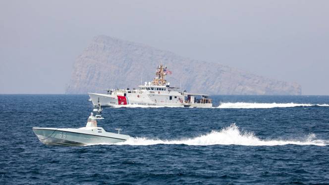 A US Navy L3 Harris Arabian Fox MAST-13 drone boat and the US Coast Guard cutter USCGC John Scheuerman transit the Strait of Hormuz on Wednesday.