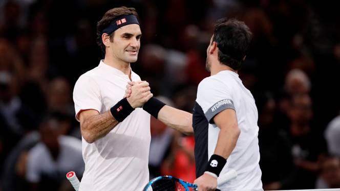 Switzerland's Roger Federer shakes hands with Italy's Fabio Fognini after winning their third round match, Tennis AccorHotels Arena, Paris, France, November 1, 2018