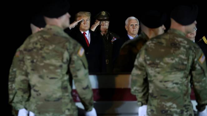 File Photo: US President Donald Trump salutes the transfer cases holding the remains of US Army soldier Sergeant Javier Jaguar Gutierrez, who was killed in the Nangarhar province in eastern Afghanistan, during a dignified transfer at Dover Air Force Base, in Dover, Delaware, US February 10, 2020.