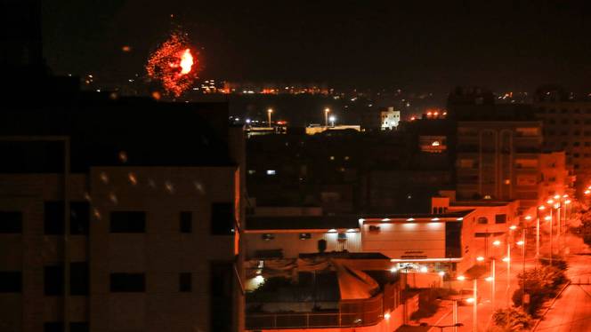 Flames are seen following an Israeli air strike on Gaza city early on November 22, 2020.