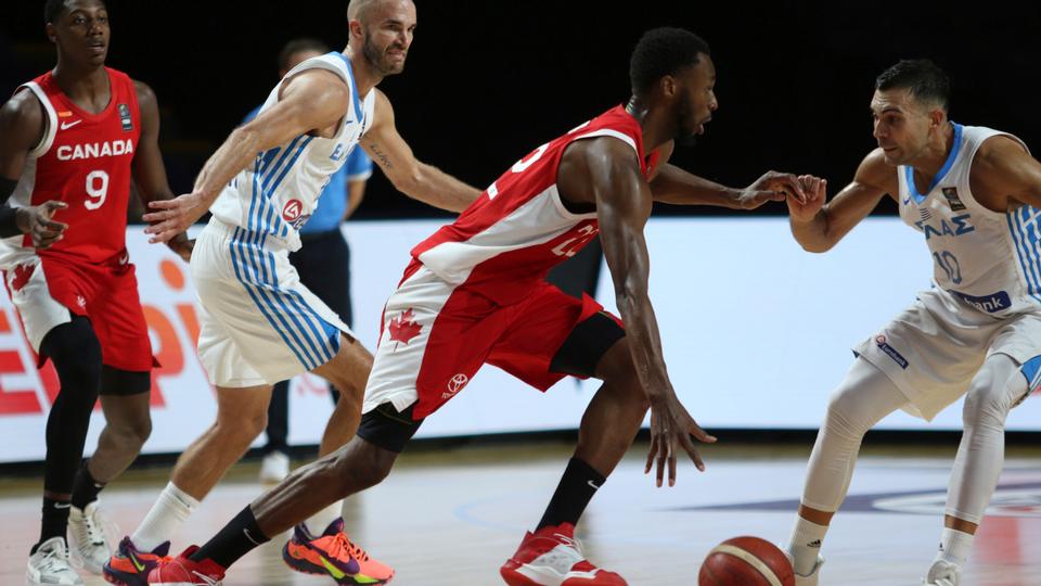 Canada's Andrew Wiggins looks for an open man as Greece players try to steal during the second half of a FIBA men's Olympic qualifying basketball game Tuesday, June 29, 2021 at Memorial Arena in Victoria, British Columbia.