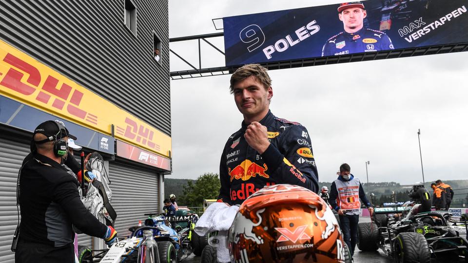 Red Bull's Dutch driver Max Verstappen celebrates taking pole position in the parc ferme after the qualifying session of the Formula One Belgian Grand Prix at the Spa-Francorchamps circuit in Spa on August 28, 2021.