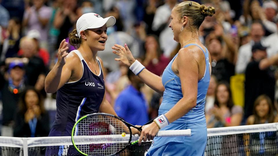 Shelby Rogers, right, greets Ashleigh Barty at the net after defeating Barty in US Open on September 4, 2021, in New York.