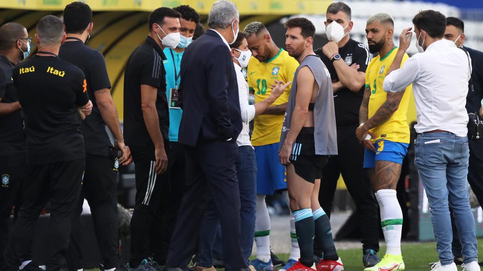 Argentina's Lionel Messi and Brazil's Neymar are seen as play is interrupted after Brazilian health officials objected to the participation of three Argentine players they say broke quarantine rules.