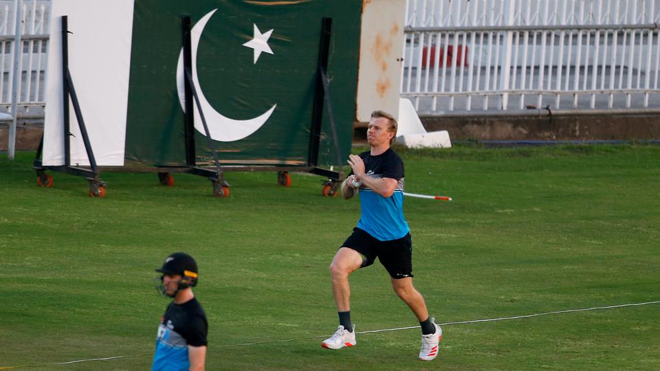 New Zealand's Scott Kuggeleijn (centre) bowls during a practice session in the Pindi Cricket Stadium, in Rawalpindi, Pakistan on September 14, 2021.