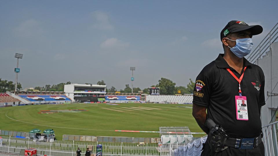 A policeman stands guard on the empty stands of the Rawalpindi Cricket Stadium in Rawalpindi, on September 17, 2021.