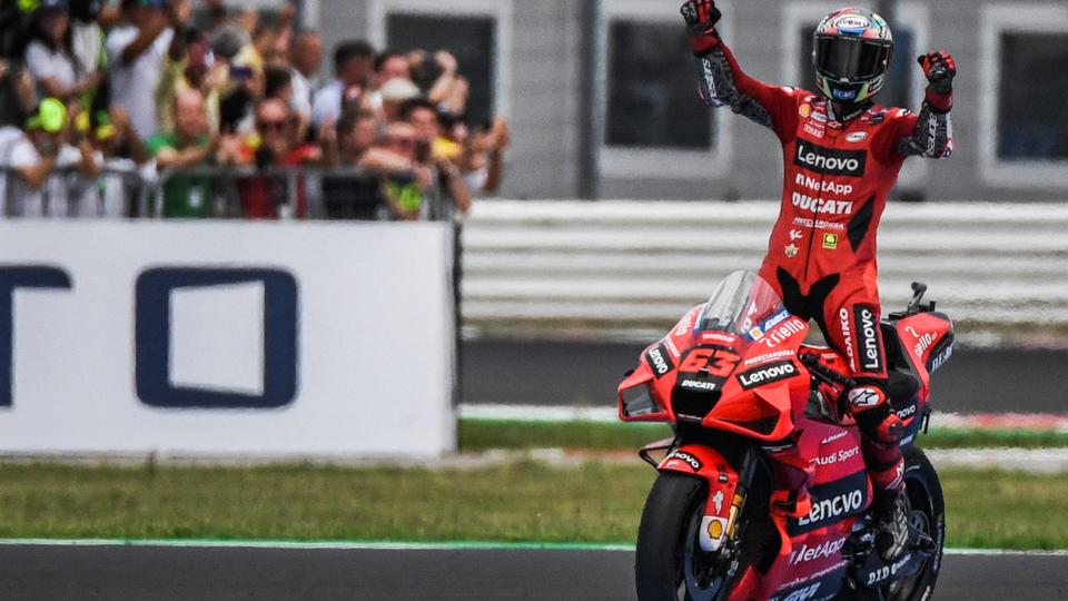 Francesco Bagnaia celebrates after winnign the San Marino MotoGP Grand Prix at the Misano World Circuit Marco-Simoncelli on September 19, 2021 in Misano Adriatico, Italy.