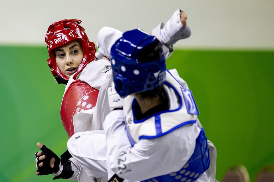 Turkish athlete Zeliha Agris (right) compete in Taekwondo with El Bouchti Oumaima (left) from Morocco. — Anadolu Agency