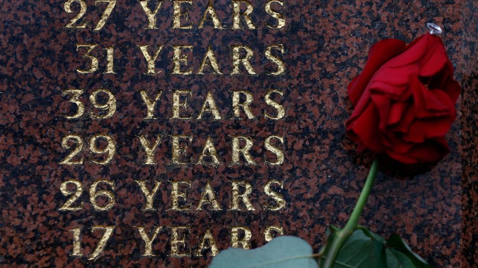 A red rose is seen placed at the Hillsborough memorial outside Liverpool Football Club's Anfield stadium in Liverpool, northern England. 96 soccer fans died in the 1989 Hillsborough stadium disaster.