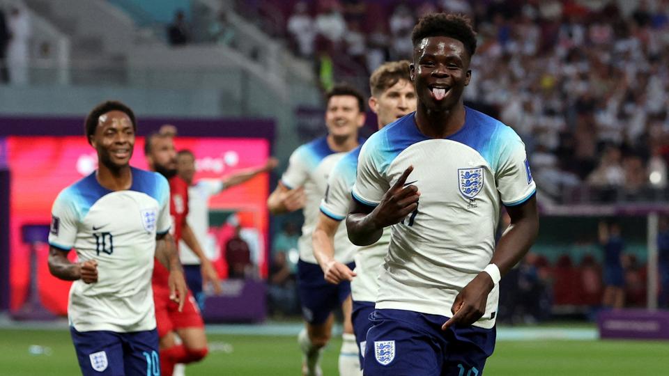 England's Bukayo Saka celebrates scoring their second goal.