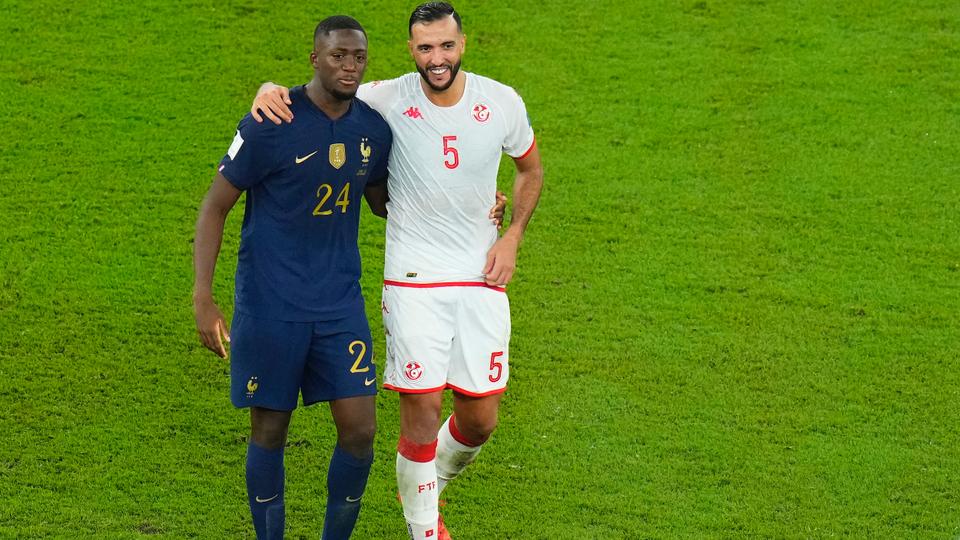 France's Ibrahima Konate, left, and Tunisia's Nader Ghandri embrace at the end of the World Cup group D soccer match between Tunisia and France at the Education City Stadium in Al Rayyan, Qatar, Wednesday, Nov. 30, 2022.