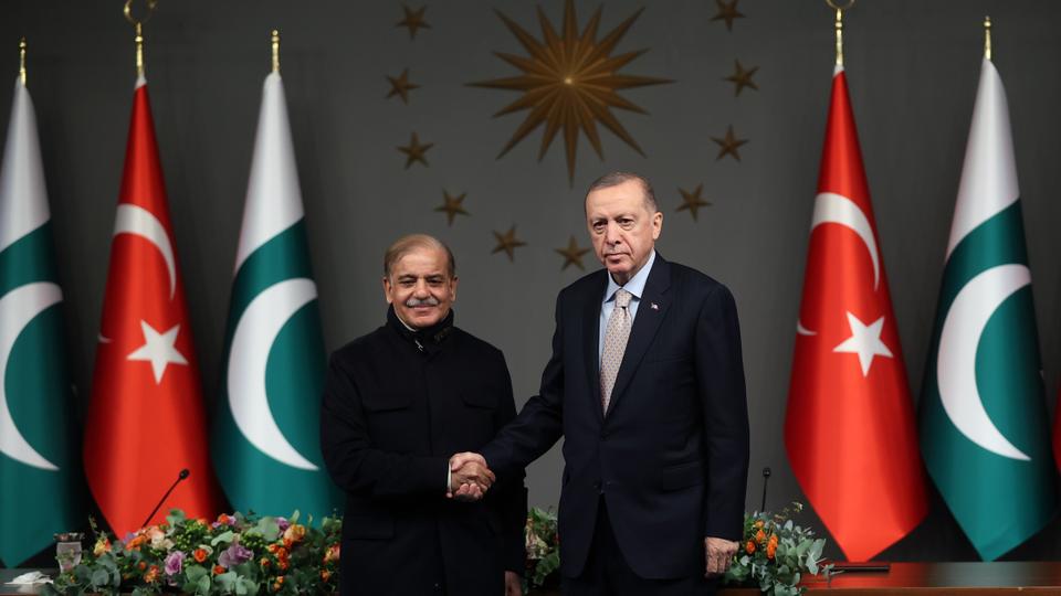 Pakistani Prime Minister Shehbaz Sharif and Turkish President Recep Tayyip Erdogan shake hands.
