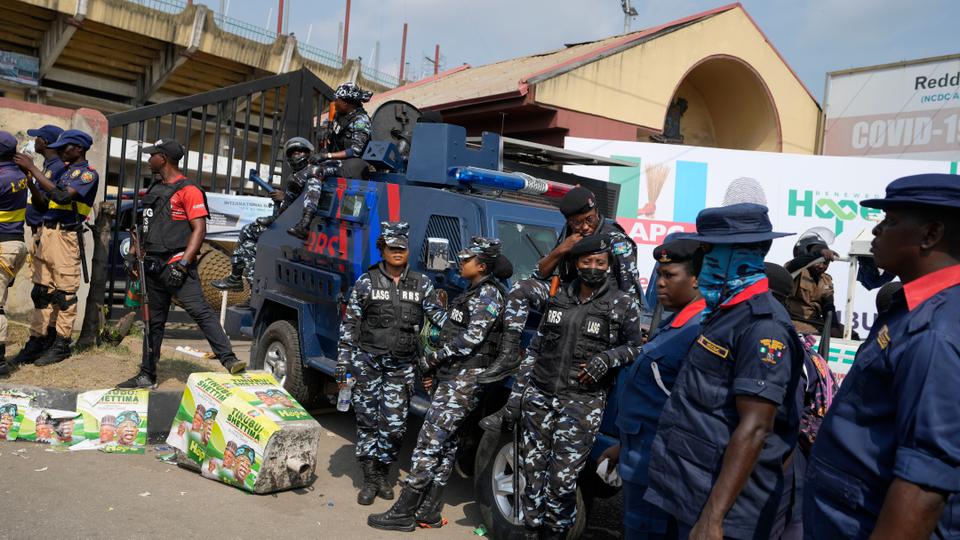 Police officers and Civil Defence provides security during an election campaign of Bola Ahmed Tinubu, presidential candidate of the All Progressives Congress, Nigeria's ruling party, ahead of 2023 Presidential elections in Lagos, Nigeria, November 26, 2022.
