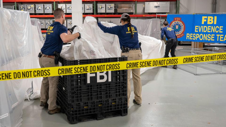 FBI special agents assigned to the evidence response team process material recovered from the high altitude balloon recovered off the coast of South Carolina, February 9, 2023, at the FBI laboratory in Quantico, VA.