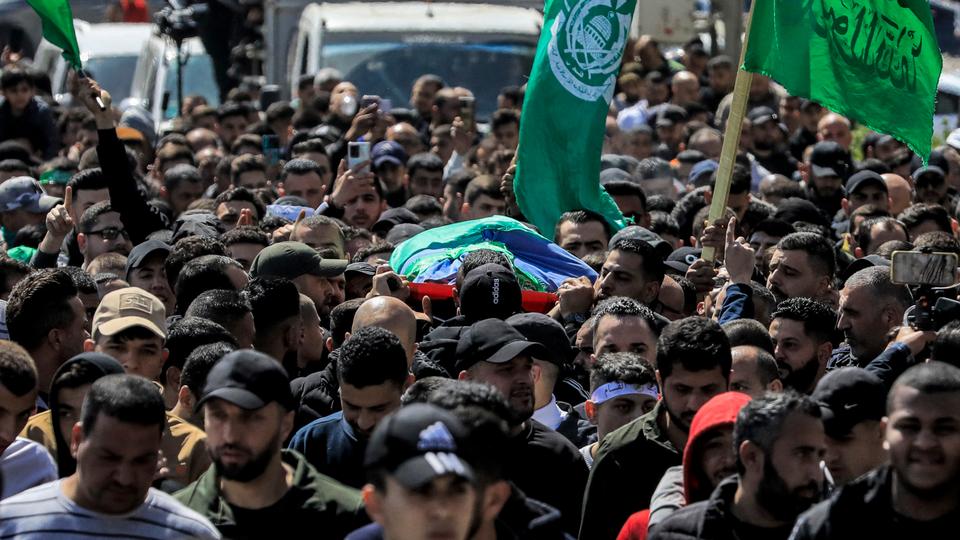 Mourners march with the body of Abdul Fattah Kharushah, a 49-year-old Palestinian fighter who was killed by Israeli troops in Jenin city.