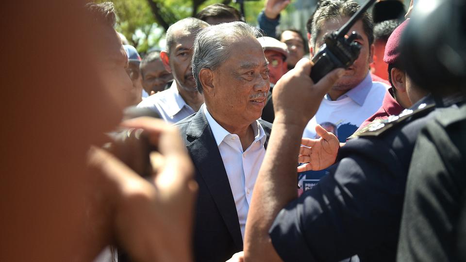 Former prime minister of Malaysia and Perikatan Nasional (PN) chairman Muhyiddin Yassin arrives at the Malaysian Anti-Corruption Commission (MACC) headquarters to give a statement over allegations that his party misused public funds meant to fight Covid-19.