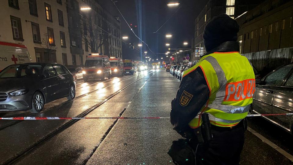 German police secures the area at the scene of a hostage situation at a pharmacy in the western German city of Karlsruhe.