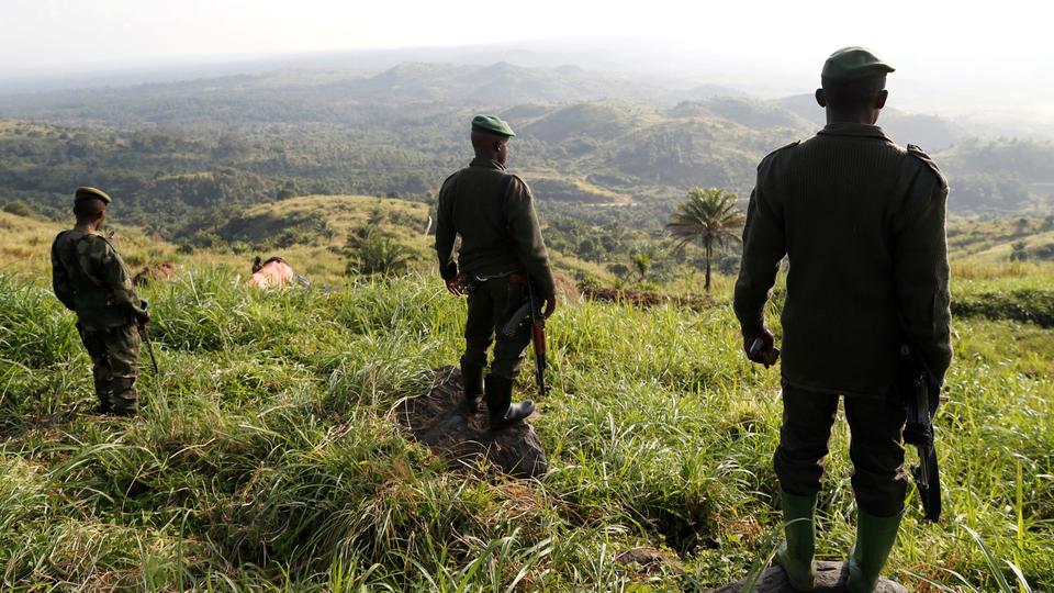 Soldiers stand in a field camp near Beni, North Kivu Province of Democratic Republic of the Congo.