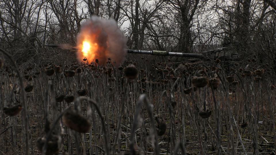 Ukrainian servicemen fire from a tank towards Russian troops near the frontline town of Bakhmut, amid Russia's attack on Ukraine, in Donetsk region.