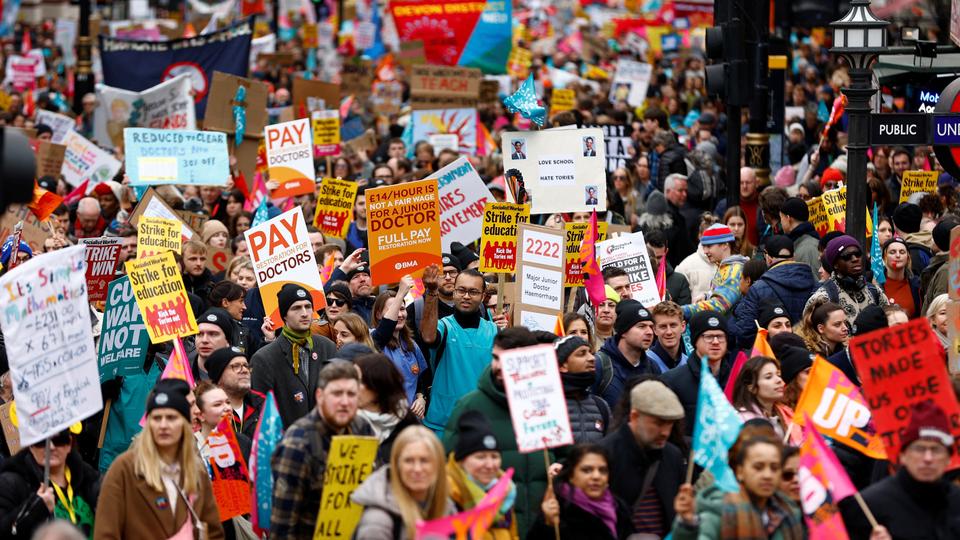 Teachers attend a march during strike action in a dispute over pay, in London.