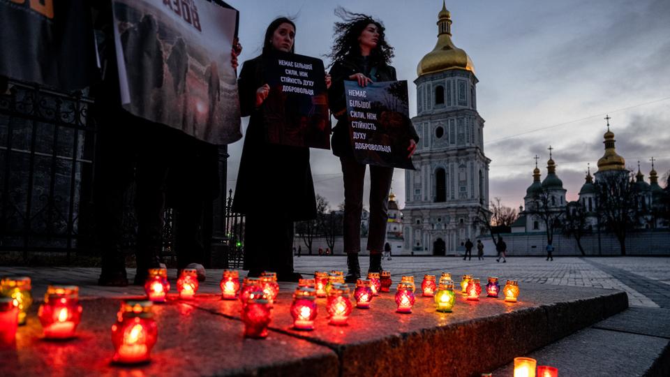 Relatives and supporters of captured Ukrainian servicemen of the Azov regiment, who were made prisoner during the siege of the port city of Mariupol, attend a rally in tribute to defenders of Ukraine of the Russian-Ukrainian War, as part of Volunteer Day, in Kiev earlier this week.