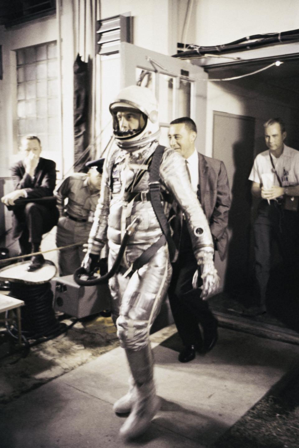 Astronaut Leroy Gordon Cooper walks in his Mercury spacesuit (Navy Mark IV) prior to the launch of his spacecraft Faith 7, on May 15, 1963 at Cap Canaveral, Florida, United States.