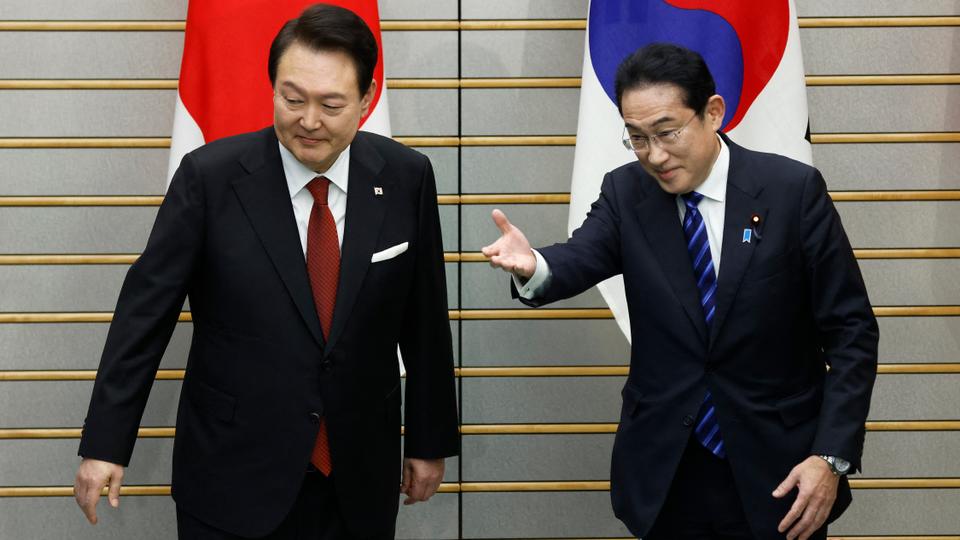 At a fence-mending summit on Thursday, Tokyo and Seoul agreed to turn the page on a bitter dispute over Japan's use of war-time forced labour.