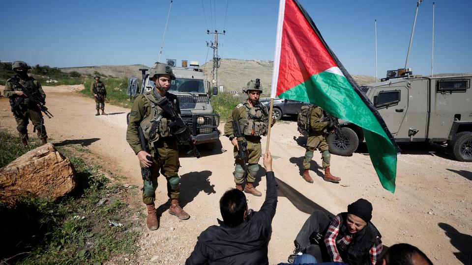 Palestinians protest against illegal Israeli settlements near Ramallah.
