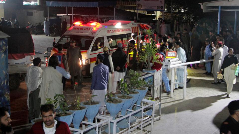 Rescue worker unload earthquake victims from an ambulance at a hospital in Saidu Sharif, a town Pakistan's Swat valley.