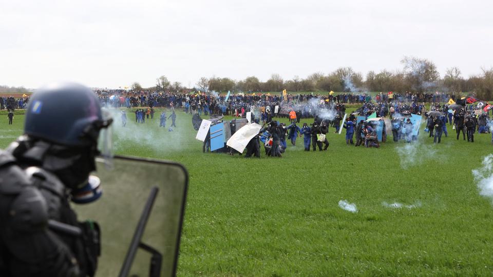 Protesters clash with riot mobile gendarmes during a demonstration called by the collective