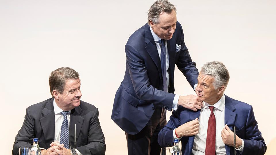 Newly appointed Group CEO of UBS Sergio Ermotti, right, outgoing CEO Ralph Hamers, centre, and UBS Chairman Colm Kelleher, left, arrive for a news conference in Zurich, Switzerland.