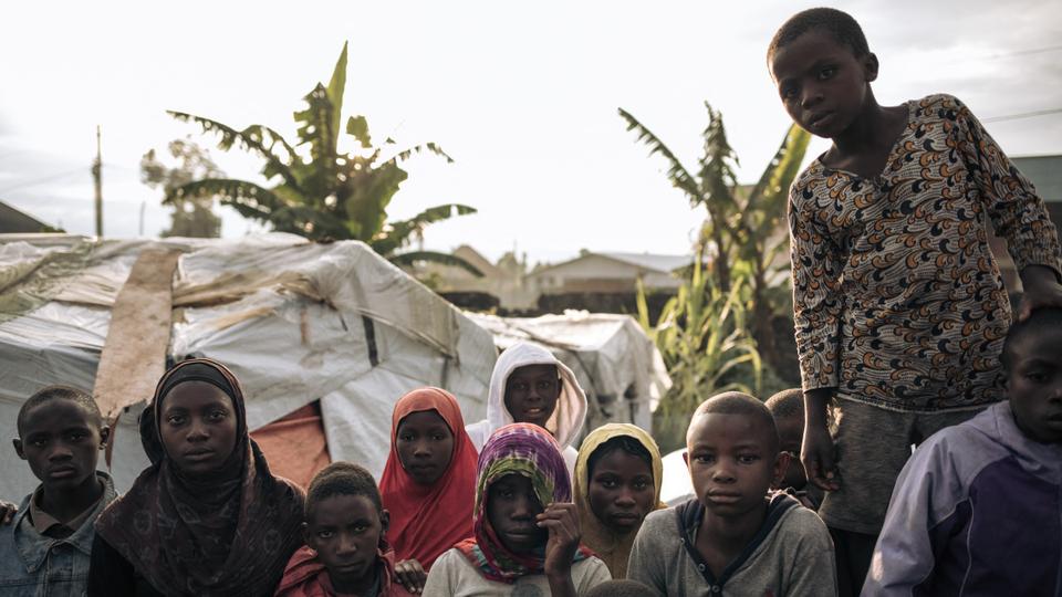 Displaced Muslim children who fled attacks by the M23 rebels wait for nightfall to break the Ramadan fast at an informal displacement camp in Goma, eastern DRC.