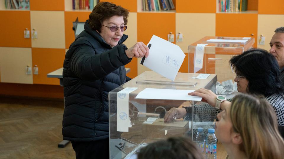 A woman votes in Bulgarian parliamentary elections at a polling station in Sofia on April 2, 2023.