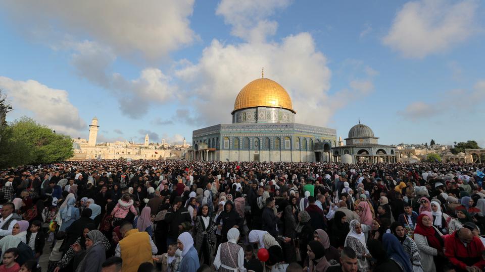 Thousands of Palestinians attend Eid al-Fitr prayers at the compound that houses Al-Aqsa mosque on Friday.