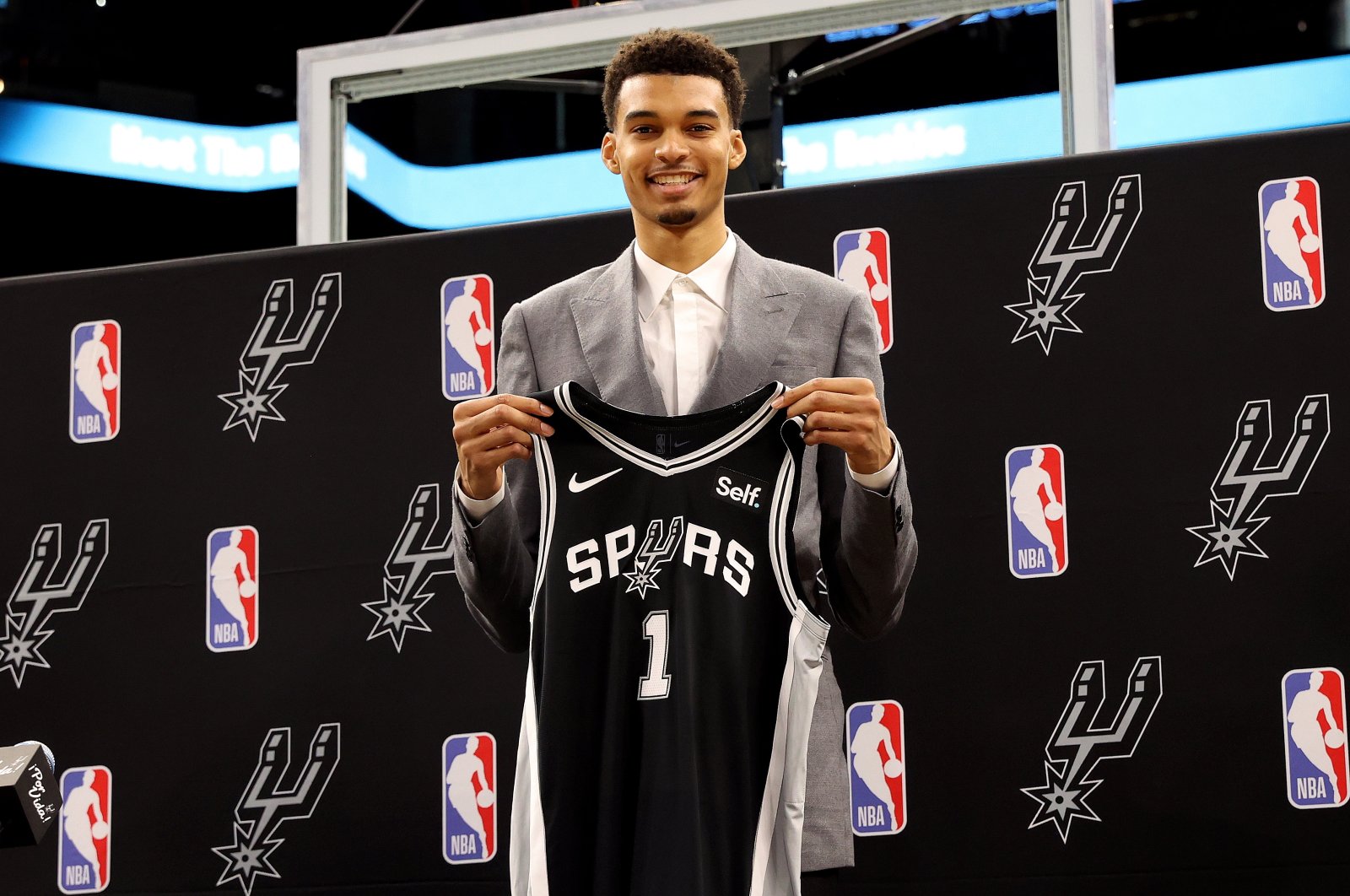 San Antonio Spurs first round pick Victor Wembanyama of France poses with his jersey during a press conference at the AT&T Center, Texas, U.S., June 24, 2023. (EPA Photo)
