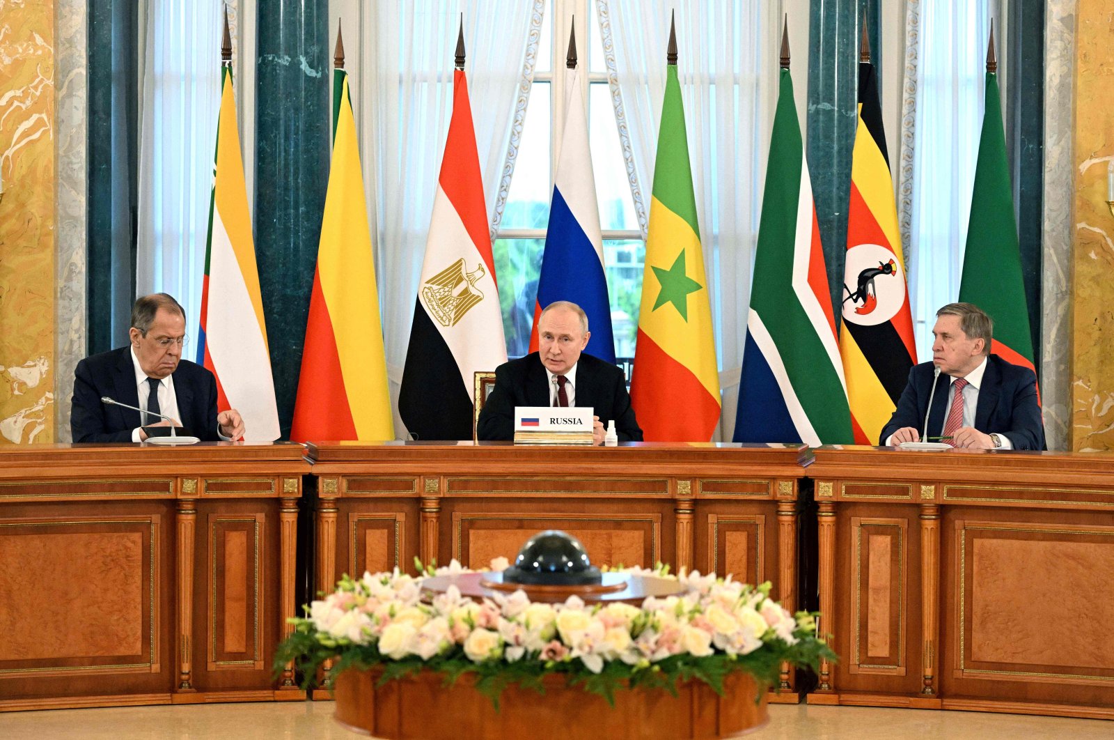 Russian President Vladimir Putin (C), his adviser Yuri Ushakov (R) and Russian Foreign Minister Sergei Lavrov (L) taking part in a meeting with delegation of African leaders at the Constantine (Konstantinovsky) Palace in Strelna, outside Saint Petersburg, Russia, June 17, 2023. (AFP Photo)