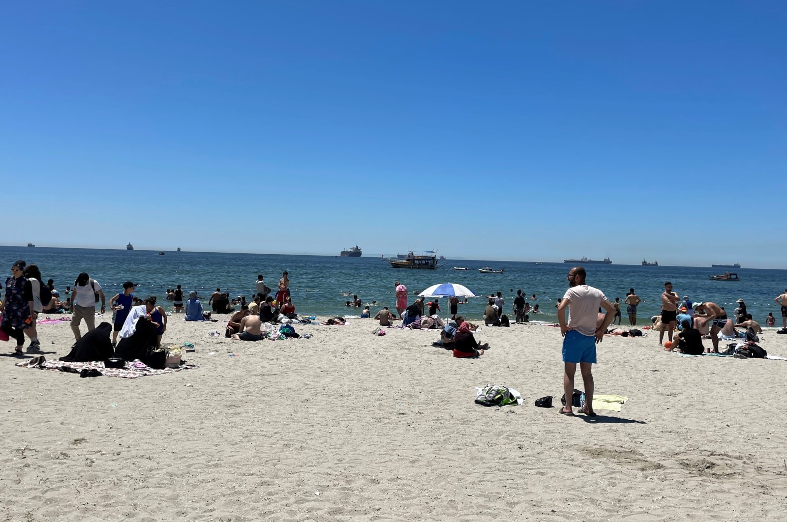 Citizens are seen cooling themselves off at the beach in Küçükçekmece district, Istanbul, Türkiye, July 1, 2023. (IHA Photo)
