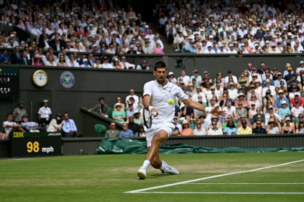 Serbia's Novak Djokovic returns the ball to Poland's Hubert Hurkacz during their men's singles tennis match on the eighth day of the 2023 Wimbledon Championships at The All England Tennis Club in Wimbledon, London, U.K., July 10, 2023. (AFP Photo)