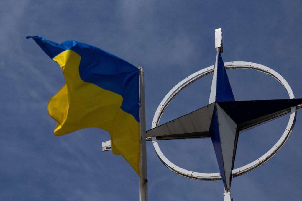 A Ukrainian national flag rises in front of the NATO emblem, in Kyiv, Ukraine, July 11, 2023. (Reuters Photo)