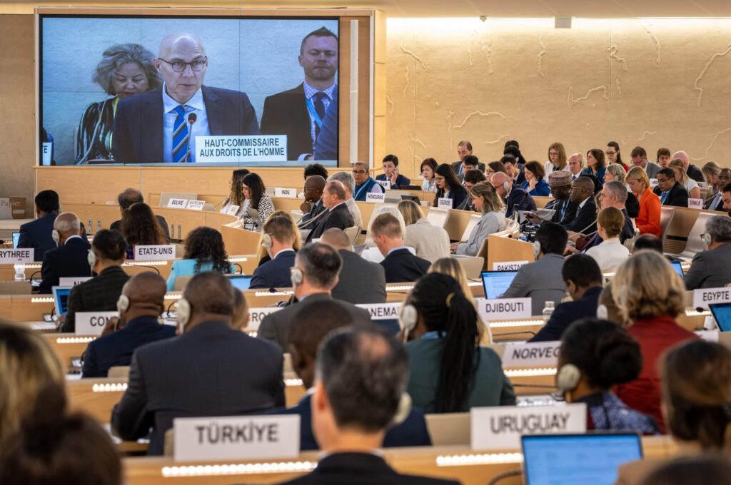 U.N. High Commissioner for Human Rights Volker Turk (C) is seen on a giant screen as he delivers a speech at the opening of the 53rd U.N. Human Rights Council in Geneva, on June 19, 2023. (AFP File Photo)