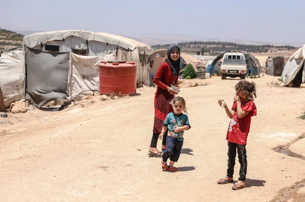 Children play at an internally displaced person camp bordering Türkiye in opposition-held Idlib region, northern Syria, July 6, 2023. (AA Photo)