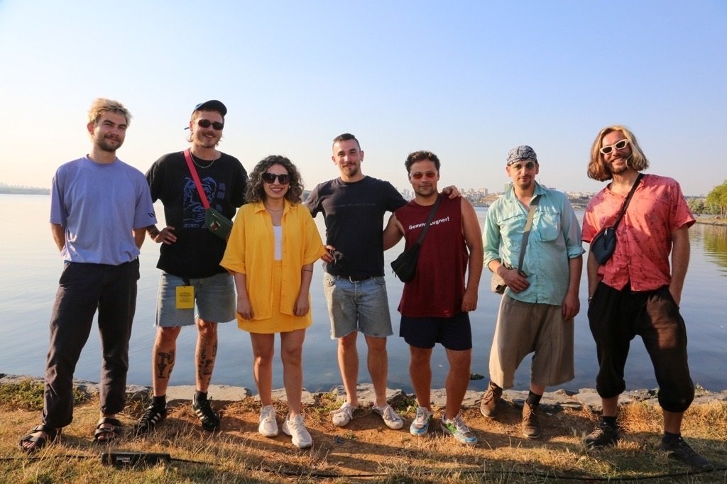 282234 Daily Sabah's Buse Keskin and Takeshi's Cashew band members pose after the interview in front of Küçükçekmece Lake, Istanbul, Türkiye, July 10, 2023. (Photo by Buse Keskin)