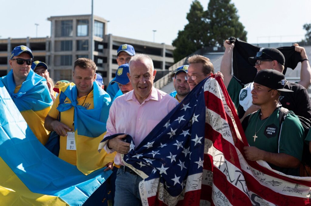 Sacramento Mayor Darrell Steinberg poses with Ukrainian and American players during the opening ceremony of the Homeless World Cup, an international soccer competition for people living without permanent shelter or in rehab centers, at the Hornet Stadium, Sacramento, California, U.S., July 8, 2023. (Reuters Photo)