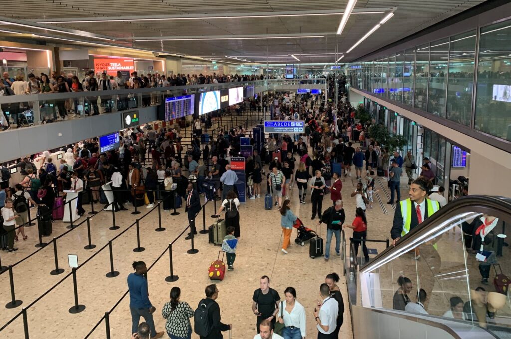 Travelers wait at the departure area as airport employees stage a strike causing flight delays and cancellations at the Geneva Airport, Geneva, Switzerland, June 30, 2023. (Reuters Photo)