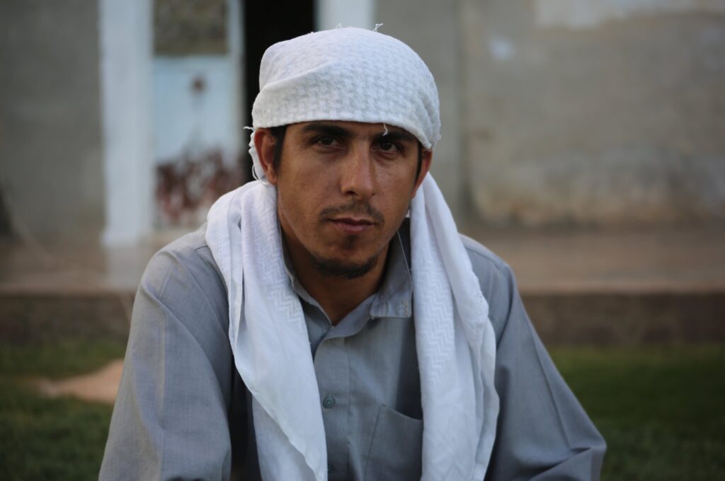 Ahmad Muhammad al-Hasan poses for a picture during an interview with Anadolu Agency (AA) in the garden of his home in Tel Abyad, Syria, July 14, 2023. (AA Photo)