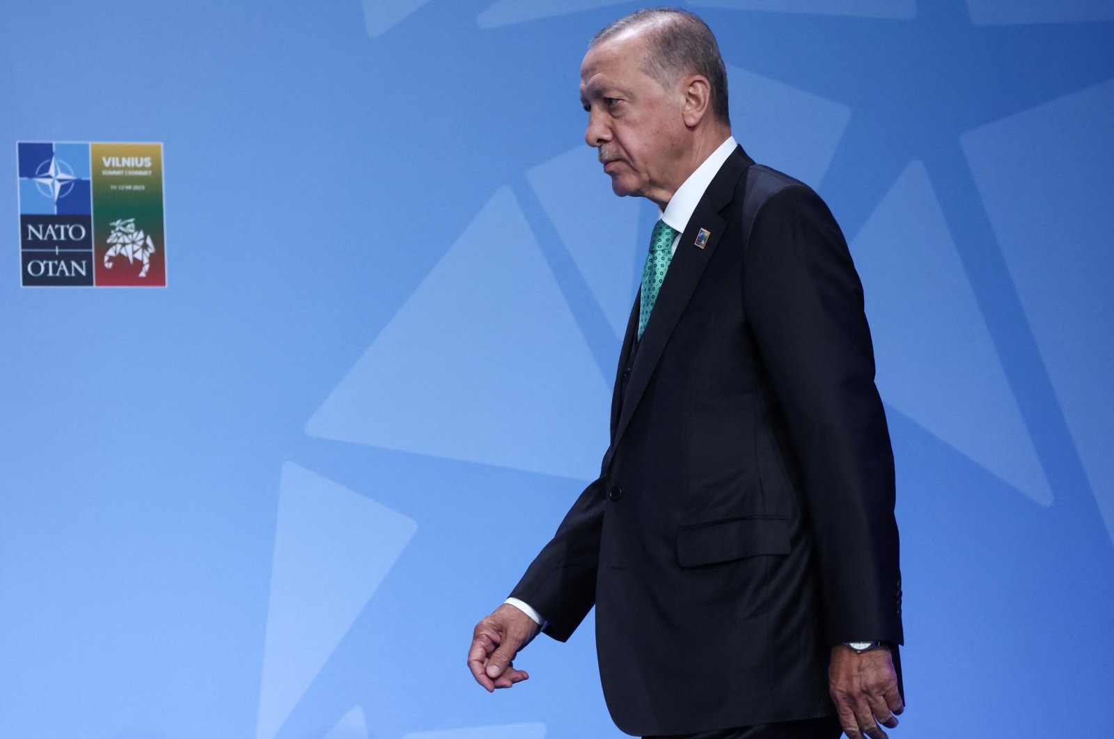 President Recep Tayyip Erdoğan walks as he holds a press conference during a NATO leaders summit in Vilnius, Lithuania July 12, 2023. (Reuters Photo)