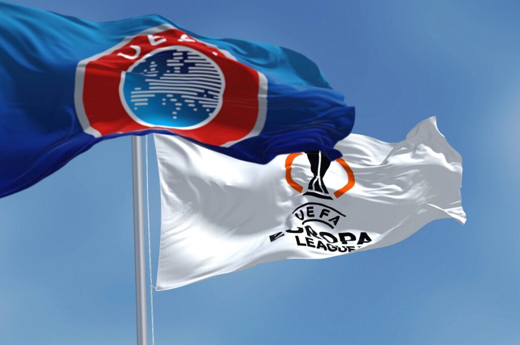 Flags with UEFA and UEFA Europa League flutter in the wind, July 2022. (Shutterstock File Photo)